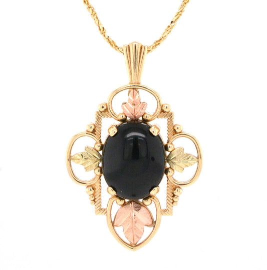 Two Tone Black Hills Gold Leaf Motif Pendant Accented with an Oval Onyz on a Fancy Diamond Cut Chain